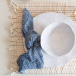 Altria napkin set on palmsa placemat with mariana dishes