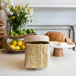 Maidstone napkins in cocobana lidded basket on table
